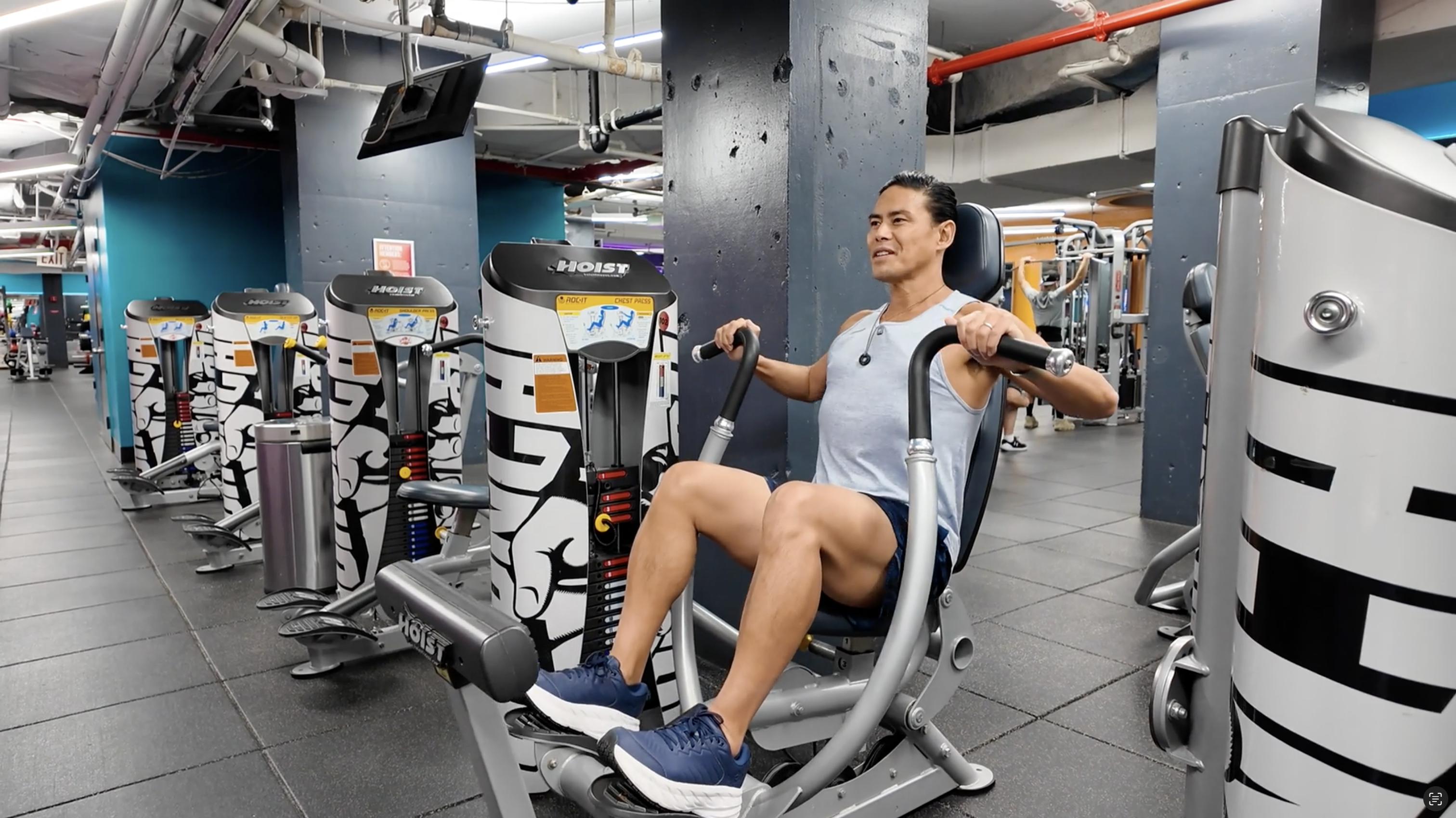 Person using chest press machine