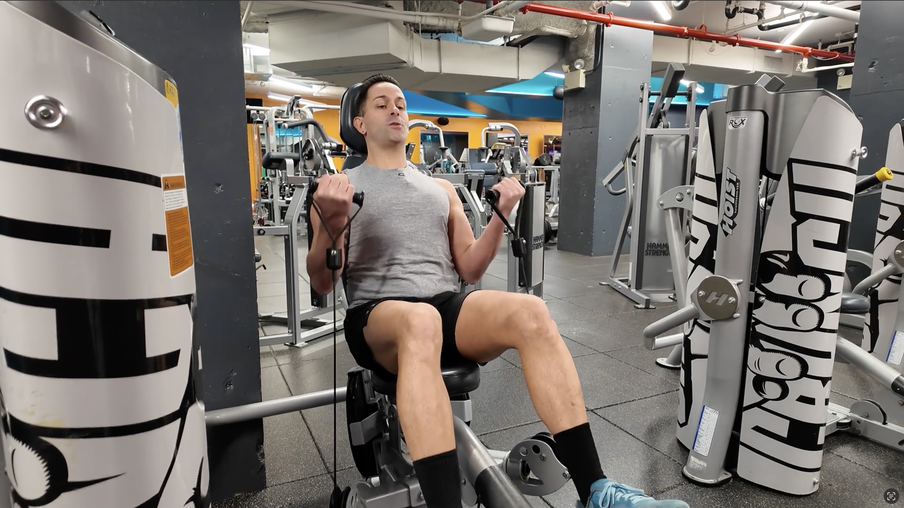 Person using lat pulldown machine